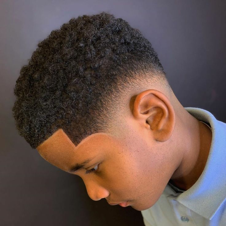 Young boy with a fresh taper fade and defined line-up